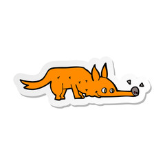 sticker of a cartoon fox sniffing floor
