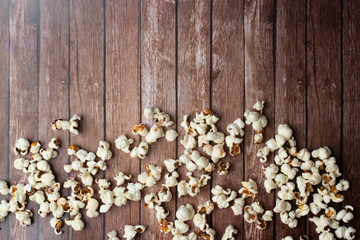 Fresh made Popcorn on an old and rustic wooden table