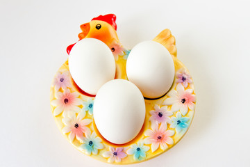easter eggs in a bowl on white background