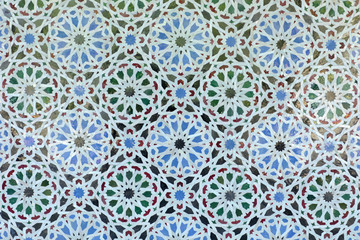 Arabic pattern on a tiled wall of a Muslim building, abstract background and texture