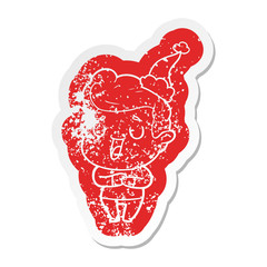 happy cartoon distressed sticker of a man wearing santa hat
