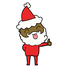 man with beard sticking out tongue wearing santa hat