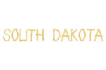 Word SOUTH DAKOTA laid out of long sticks of fried french fries isolated on white background