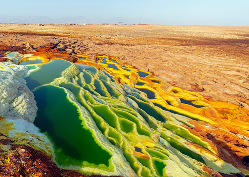 Hot springs bring mineral up to the surface and create fantastic colorful ponds and terraces at Dallol volcano in Danakil Depression of Ethiopia.