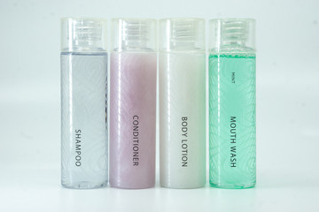 Hotel toiletry, shampoo, conditioner, body lotion and mouth wash.
