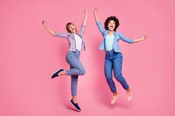 Full length body size view of two person nice-looking lovely charming cheerful cheery girls flying...