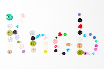 Inscription Knob made of tailor's knobs of m