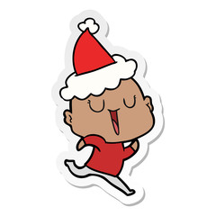 happy sticker cartoon of a bald man wearing santa hat