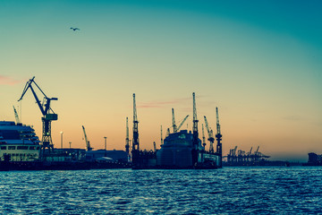 Fototapeta na wymiar Hamburg harbour and shipyard on the Elbe river, Hamburg, Germany