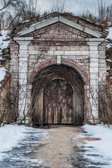 Old wooden door of Daugavgrivas fortress,  Latvia. Main entrance.