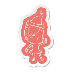 cartoon  sticker of a squinting girl wearing santa hat