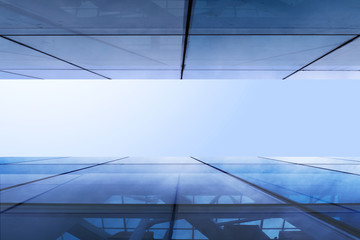  facade of a glass building and sky bottom view