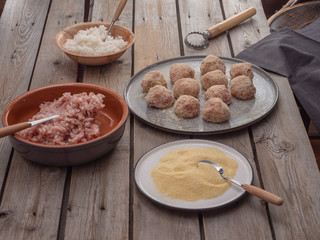 Cooking meatballs from minced turkey and rice. Ready meatballs on a large ceramic plate.