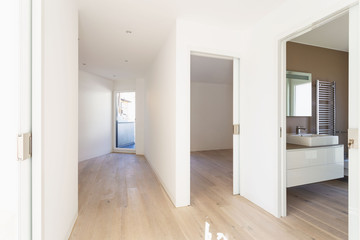 Fototapeta na wymiar Corridor with open room doors and modern bathroom
