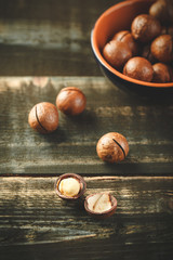 Obraz premium Macadamia nuts on wooden table