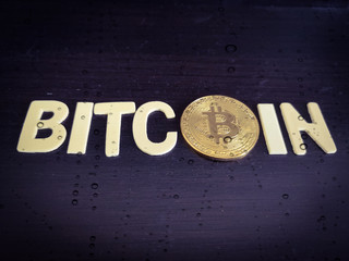 A text bitcoin with a colorful background