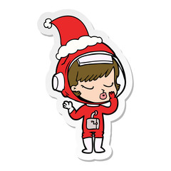 sticker cartoon of a pretty astronaut girl wearing santa hat