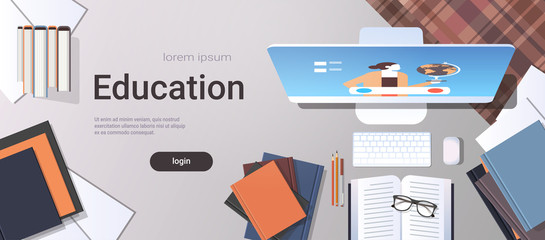 university student workplace e-learning online education concept top angle view desktop with books and computer monitor office stuff horizontal copy space
