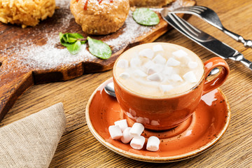 drink hot chocolate and marshmallows. marshmallows next to attributes.