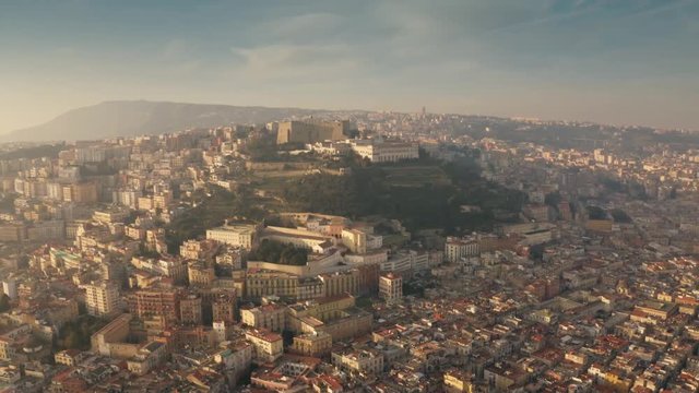 Aerial shot of famous Castel Sant'Elmo castle on the top of the hill and the cityscape of Naples, Italy