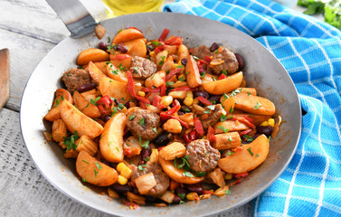 Vegetables from the pan with meat chunks