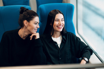 Positive young female in public transport, bus, tram, trolley bus.