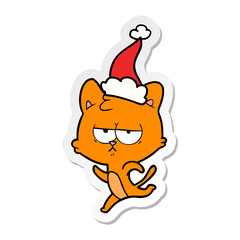 bored sticker cartoon of a cat wearing santa hat