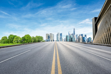 Fototapeta premium Asphalt road and modern city commercial building scenery in Shanghai