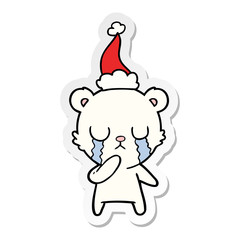 crying polar bear sticker cartoon of a wearing santa hat