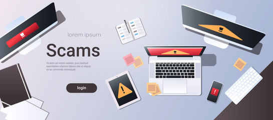 scam alert internet fraud hacking scams concept top angle view desktop computer monitor laptop tablet smartphone screen malware notification or error horizontal copy space