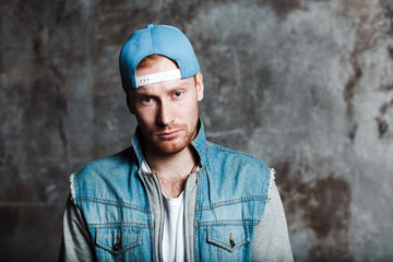 Male in a baseball cap and a denim jacket