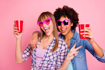Close-up portrait of two person nice cute lovely attractive cheerful girls in casual checkered...