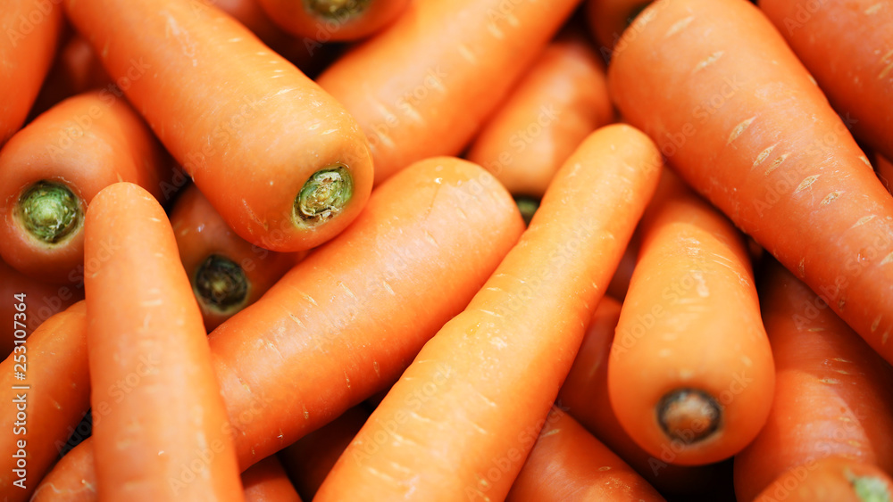 Wall mural beautiful ripe carrot background.carrots in the supermarket.