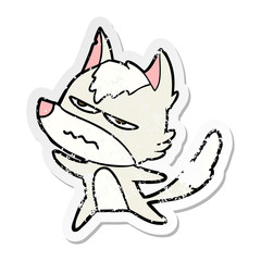 distressed sticker of a cartoon annoyed wolf