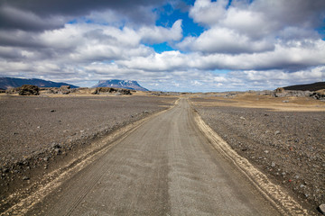 Fototapeta na wymiar Gravel road to Herdubreid tuya mountain thru Odadahraun lava field Highlands of Iceland Scandinavia