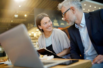 Informal meeting between salesman and manager in modern work space