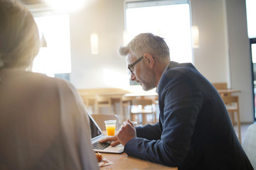 Sales business meeting between man and woman in modern