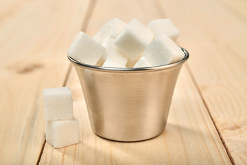 sugar cubes on a wooden table