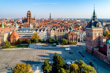 Gdansk, Poland. Old city skyline with Prison Tower, St Mary church, town hall tower, Golden Gate and  Coal Market square (Targ Weglowy).  Aerial view in sunset light