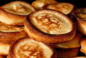 Homemade pancakes on a plate top view closeup. Shallow depth of field