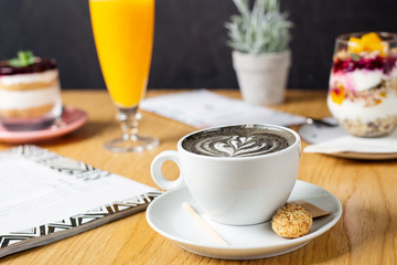 Coal latte. Black cappuccino. Black coffee with activated carbon