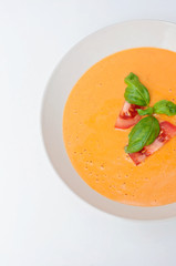 Vegan food and healthy vegetarian lifestyle. A tomato soup with nutritious ingredients like fresh basil is suitable for vegetarian plant based diet.