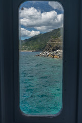 Italy, Cinque Terre, Monterosso, a view of a body of water in front of a window