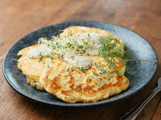 Savory vegan pea pancakes with a chives and herbed sauce