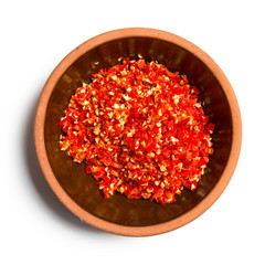 red pepper in a bowl isolated on white background