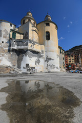 Basilica Di Santa Maria Assunta in Camogli, Italy anchors this Italian Riviera resort town.  This historic landmark is popular with tourists traveling on vacation.