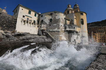 Basilica Di Santa Maria Assunta in Camogli, Italy anchors this Italian Riviera resort town.  This historic landmark is popular with tourists traveling on vacation.