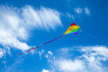 Kite flying in the sky among the clouds