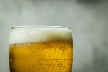 Beer foam on top of glass