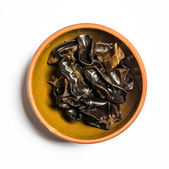 black fungus in bowl isolated on white background